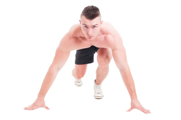 Young male runner taking ready to start position — Stock Photo, Image