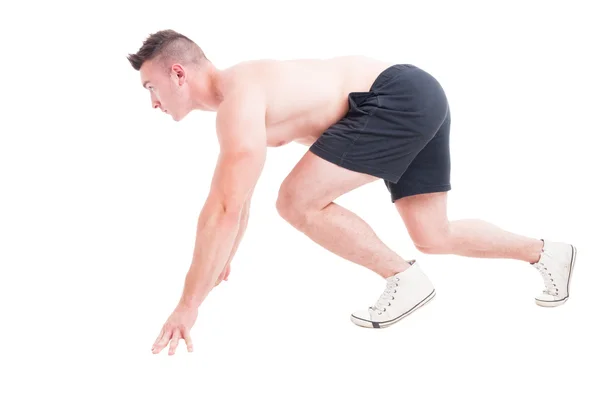Side view of a man in running start position — Stock Photo, Image