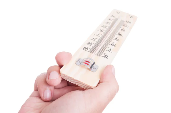 Mão segurando termômetro clássico de madeira — Fotografia de Stock
