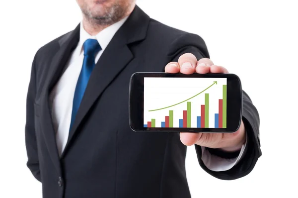 Man holding smartphone with growing financial chart — Stock Photo, Image