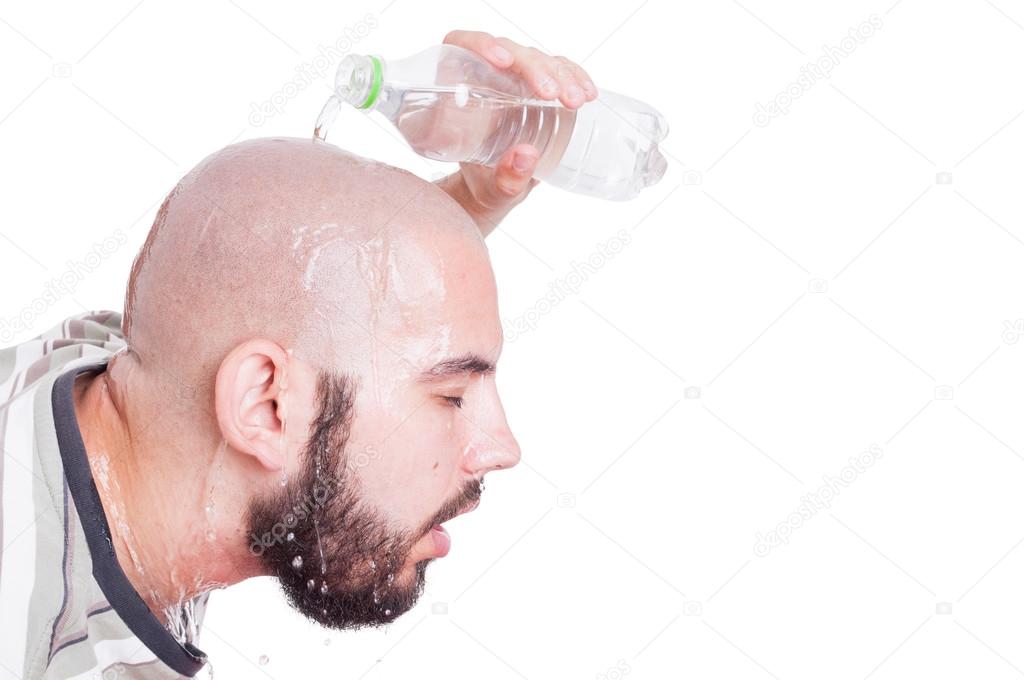 Man refreshing or cooling his head with cold water