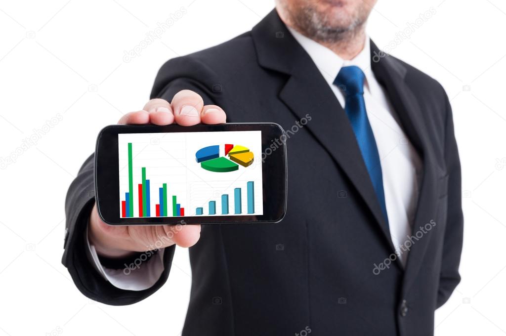 Marketing manager holding smartphone with growing financial char