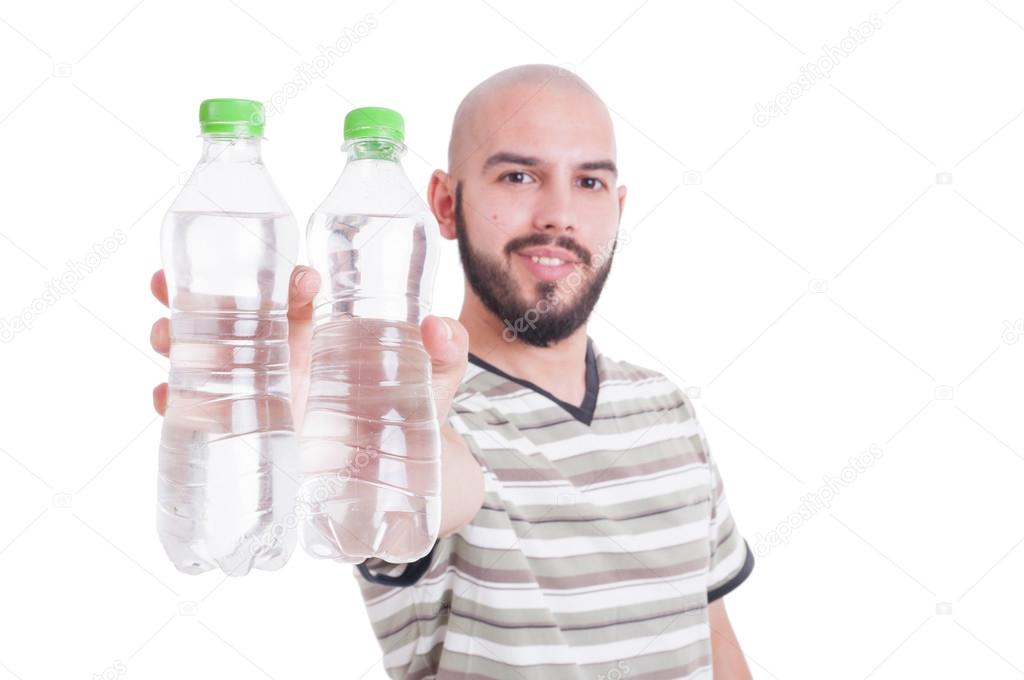 Happy man holding two bottles of cold water