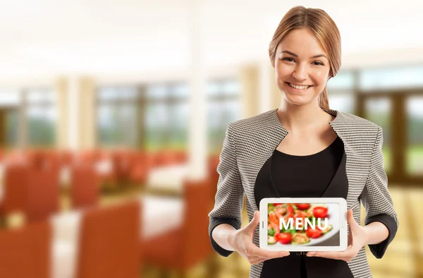 Woman restaurant manager holding tablet with menu