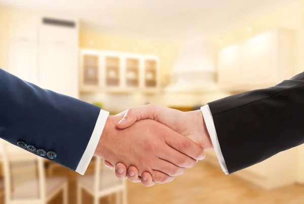 Buy or sale real estate concept with businessmen handshake