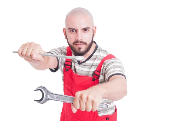 Mechanic or plumber in fighting position with wrenches — Stock Photo, Image