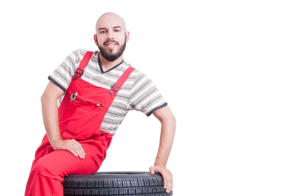 Nice mechanic waiting and sitting — Stock Photo, Image