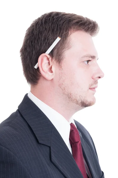 Suited man holding a cigarette behind ear — Stock Photo, Image