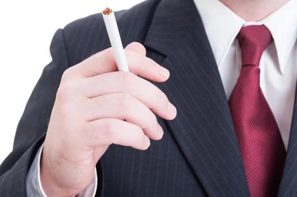 Elegant businessman hand holding an unlit cigarette — Stock Photo, Image