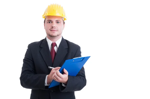 Construction inspector with suit and hardhat holding clipboard — Stock Photo, Image