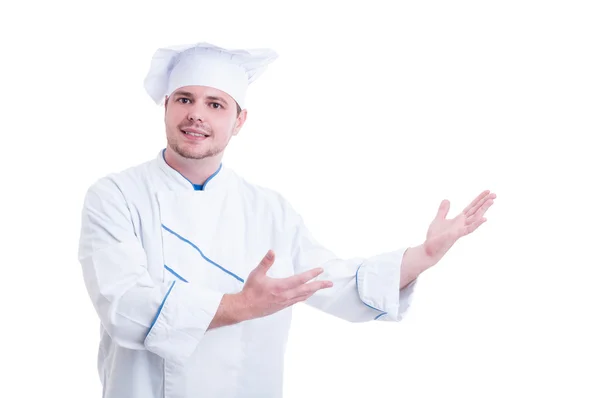 Chef ou cozinheiro mostrando apresentando algo no espaço de cópia branca — Fotografia de Stock