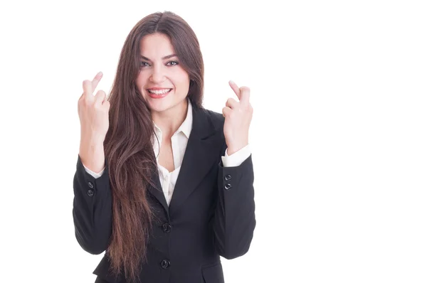 Business woman making good luck gesture by crossing fingers — Stock Photo, Image
