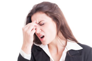 Business woman having a painful migraine after stress