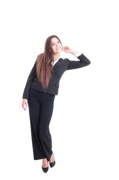 Full body of young business woman leaning on something — ストック写真
