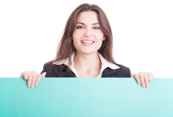 Smiling business woman or teacher holding green empty cardboard — Stock Photo, Image
