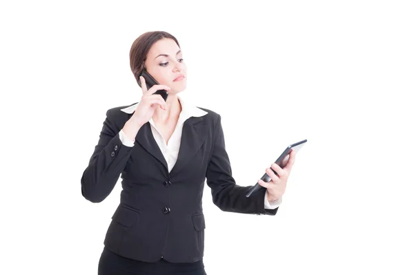 Confident and busy young business woman using tablet and phone — Stock Photo, Image