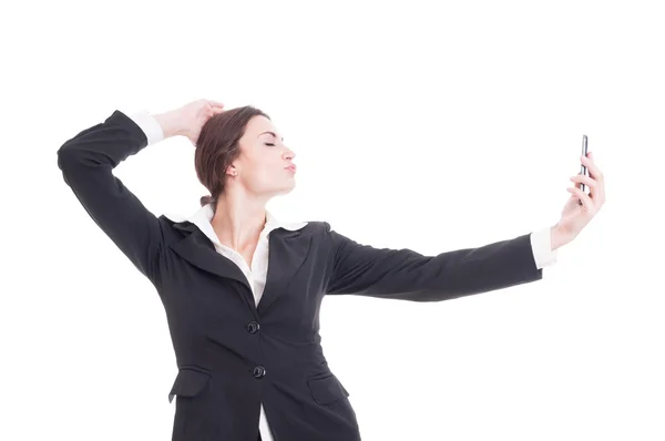 Young, beautiful business woman taking a selfie acting sexy — Stock Photo, Image