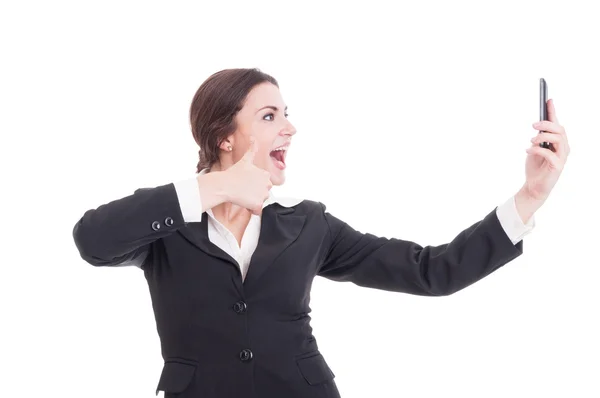 Young, beautiful business woman taking a selfie showing like ges — Stock Photo, Image