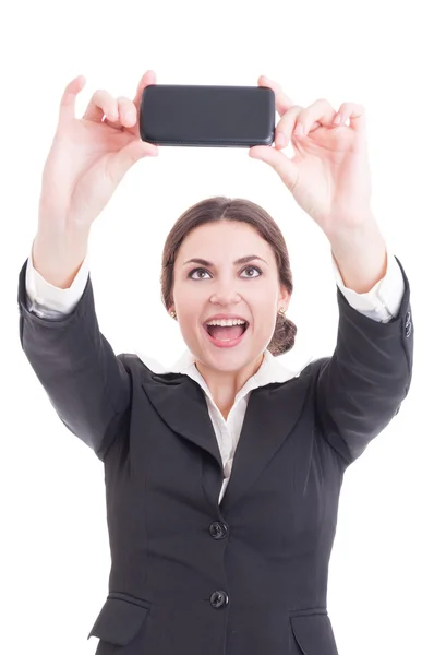 Beautiful young business woman taking a selfie using smartphone Stock Picture