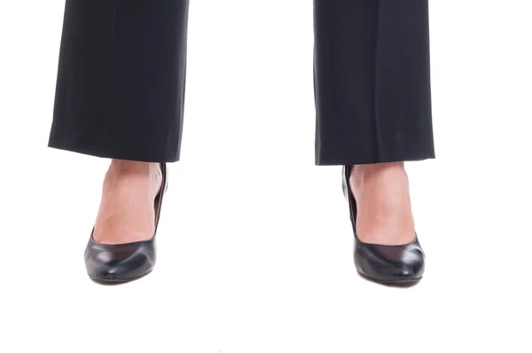 Close-up of business woman feet wearing black shoes standing spr — Stock Photo, Image