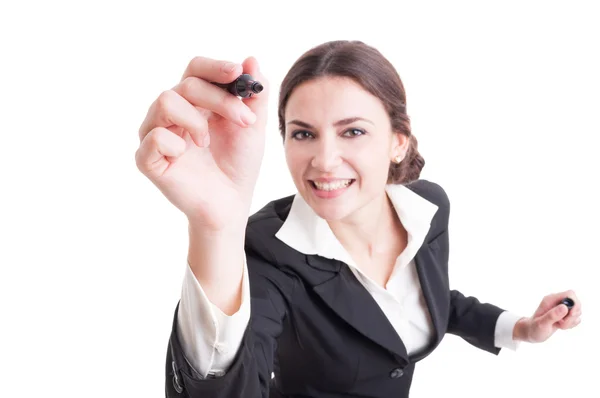 Smiling business woman writing with black marker on transparent — Stock Photo, Image
