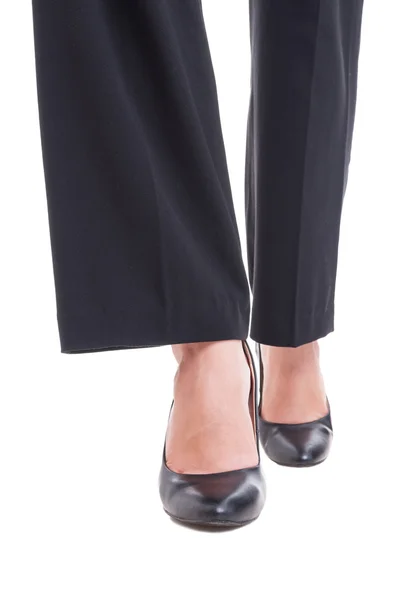 Close-up of business woman feet wearing black shoes walking — Stok Foto