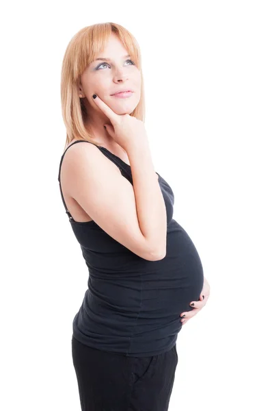 Jovem e grávida loira mulher pensando e imaginando gesto — Fotografia de Stock