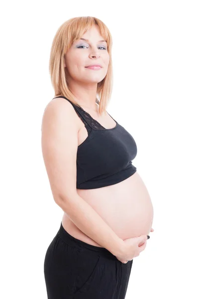 Proud and confident young pregnant lady isolated on white Royalty Free Stock Photos