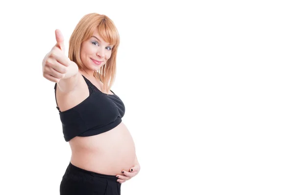 Glada leende gravid kvinna visar som gest — Stockfoto