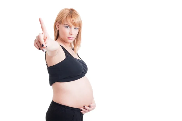 Ganska ung gravid kvinna visar nummer ett med pekfinger — Stockfoto