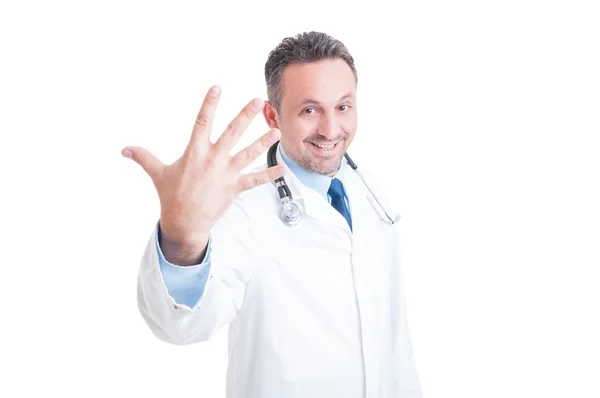 Smiling doctor showing number five or fifth — Stok fotoğraf