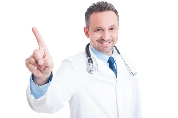 Doctor or medic pointing finger on invisible transparent screen Royalty Free Stock Photos