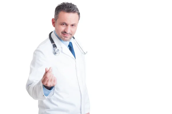 Лікар або медик, який просить гроші і хабар з жестом — стокове фото