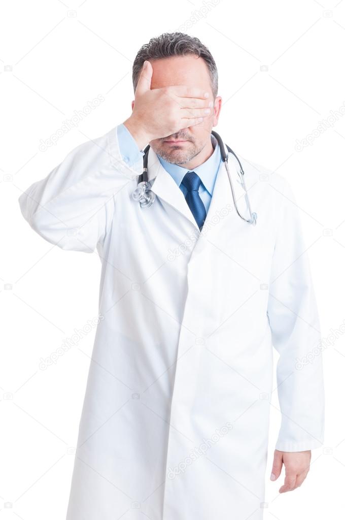 Medic or doctor covering his eyes as confidentiality concept