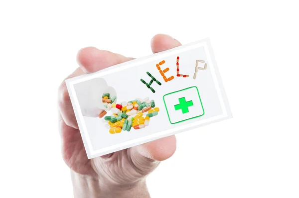 手拿着药剂的帮助或援助卡 — 图库照片