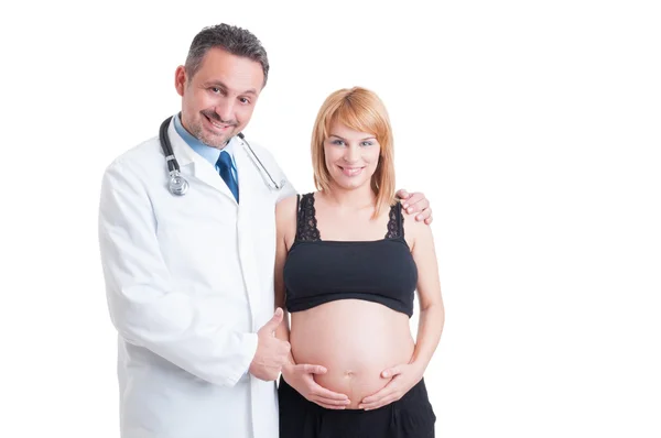 Encourager le médecin ou le médecin montrant comme avec jeune femme enceinte — Photo