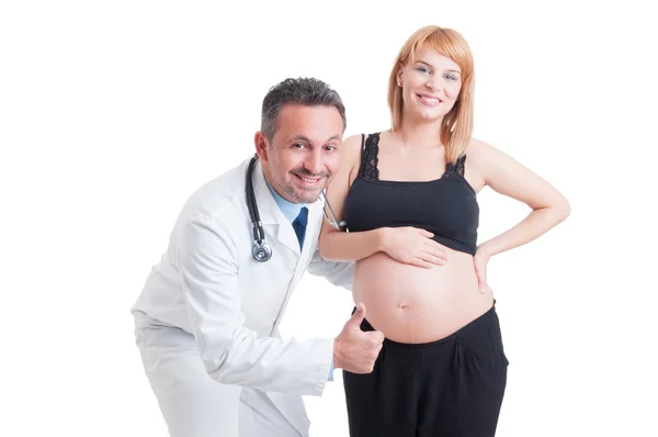 Uppmuntra läkare visar som med ung gravid kvinna — Stockfoto