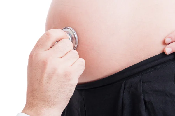 Closeup with stethoscope and pregnant woman belly or tummy — Stock Photo, Image