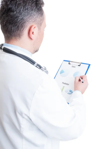 Hospital manager  reading financial charts and sales prediction — Stock Photo, Image