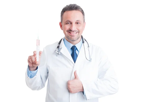 Encouraging doctor or medic holding syringe and showing like ges — Stock Photo, Image