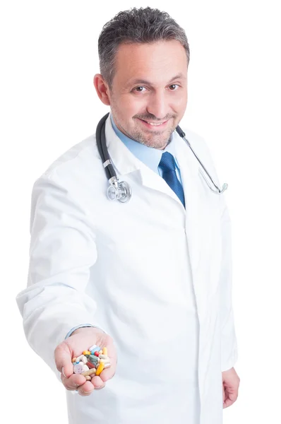 Doctor or medic offering a handful of pills — Stock Photo, Image