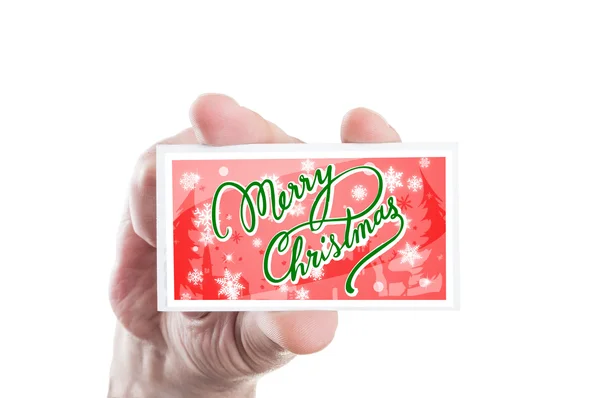 Ruka držící červená vánoční přání — Stock fotografie