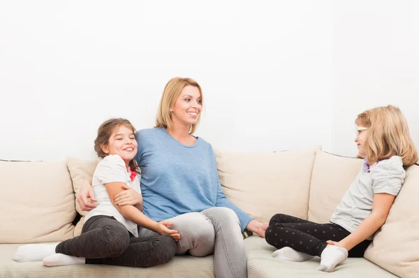 Happy sisters and young blonde mother — Stock Photo, Image