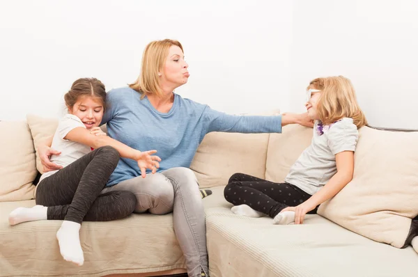 Young blonde mother having fun with her daughters — Stock Photo, Image