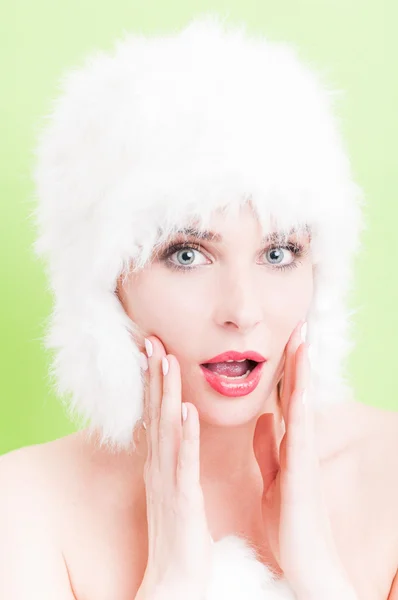 Surprised female with blue eyes wearing fur hat — Stock Photo, Image