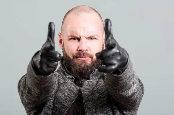 Close-up of handsome guy with beard pointing fingers — Stock Photo, Image