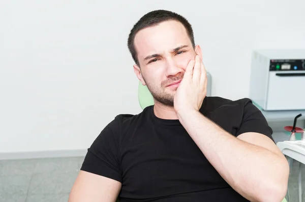 Sad dentist patient suffering toothache — Stock Photo, Image