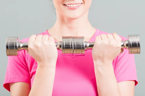 Close-up of chrome dumbbells in woman hands — Stock Photo, Image