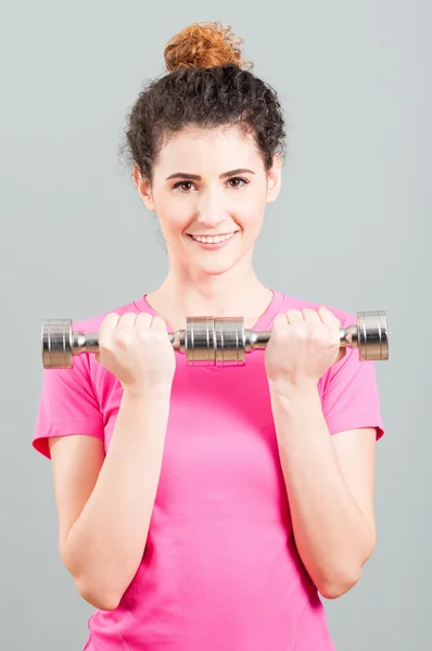 Yound woman doing weight training with dumbbells — Stock Photo, Image