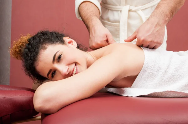 Portrait of young beautiful woman having a back massage — Stock Photo, Image